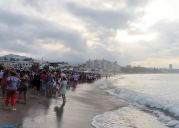 We gathered on the shoreline waiting for the throne bearers to carry the Virgen del Carmen into the sea.